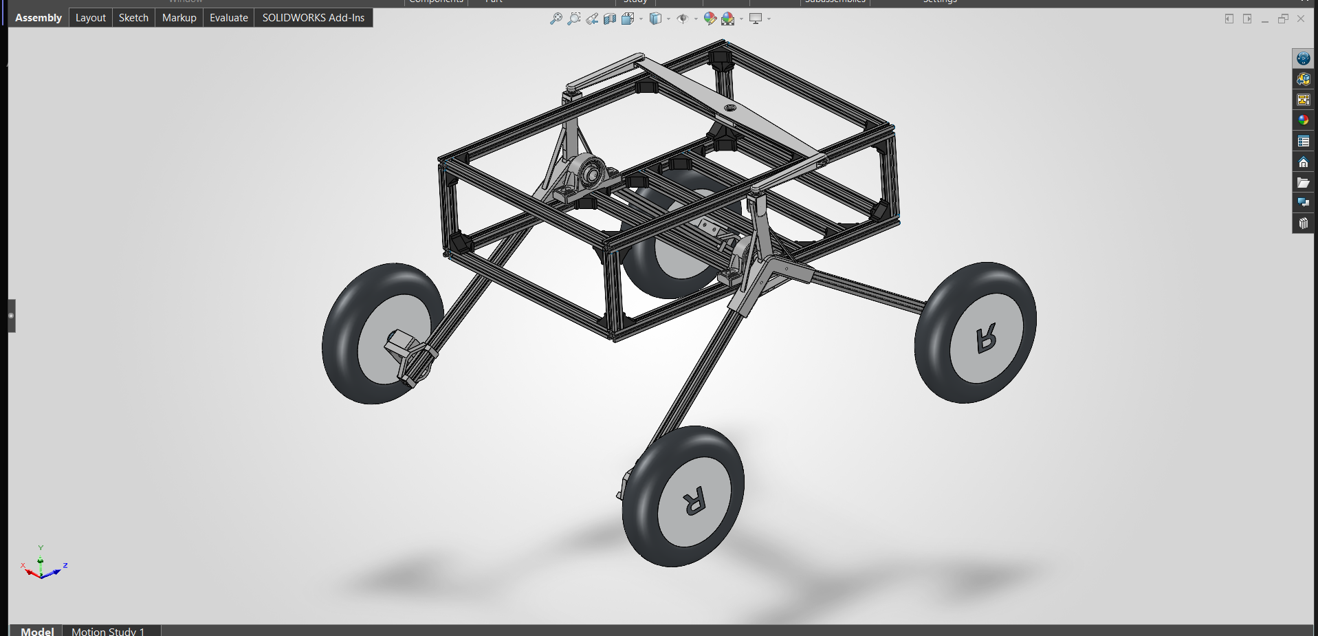 SolidWorks CAD assembly of the research rover with its T-slot frame and developing rocker-bogie suspension